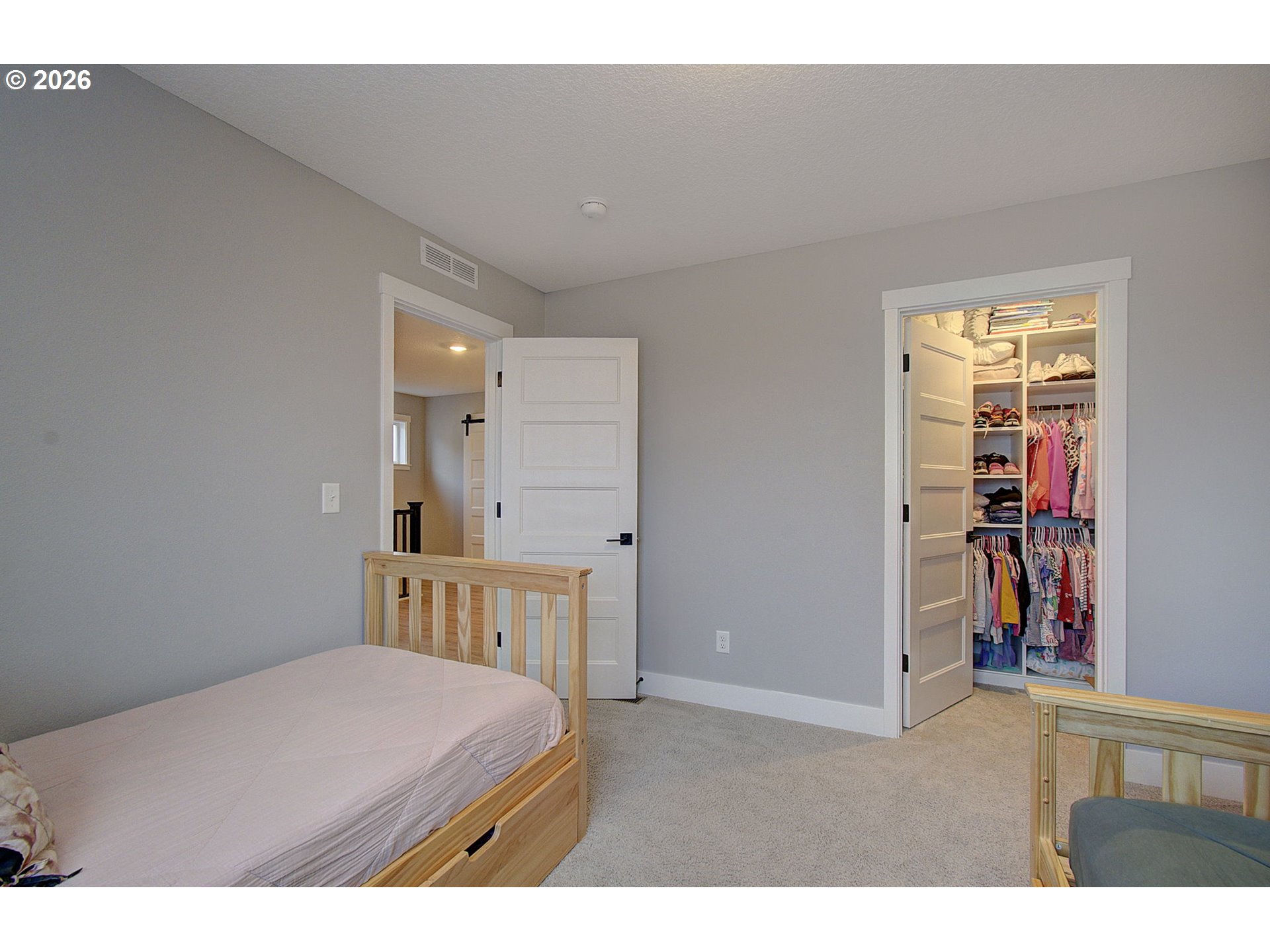 2831 Northeast 9th Avenue Battle Ground, WA 98604 - Photo 27 of 43 a bedroom with a bed closet and a window