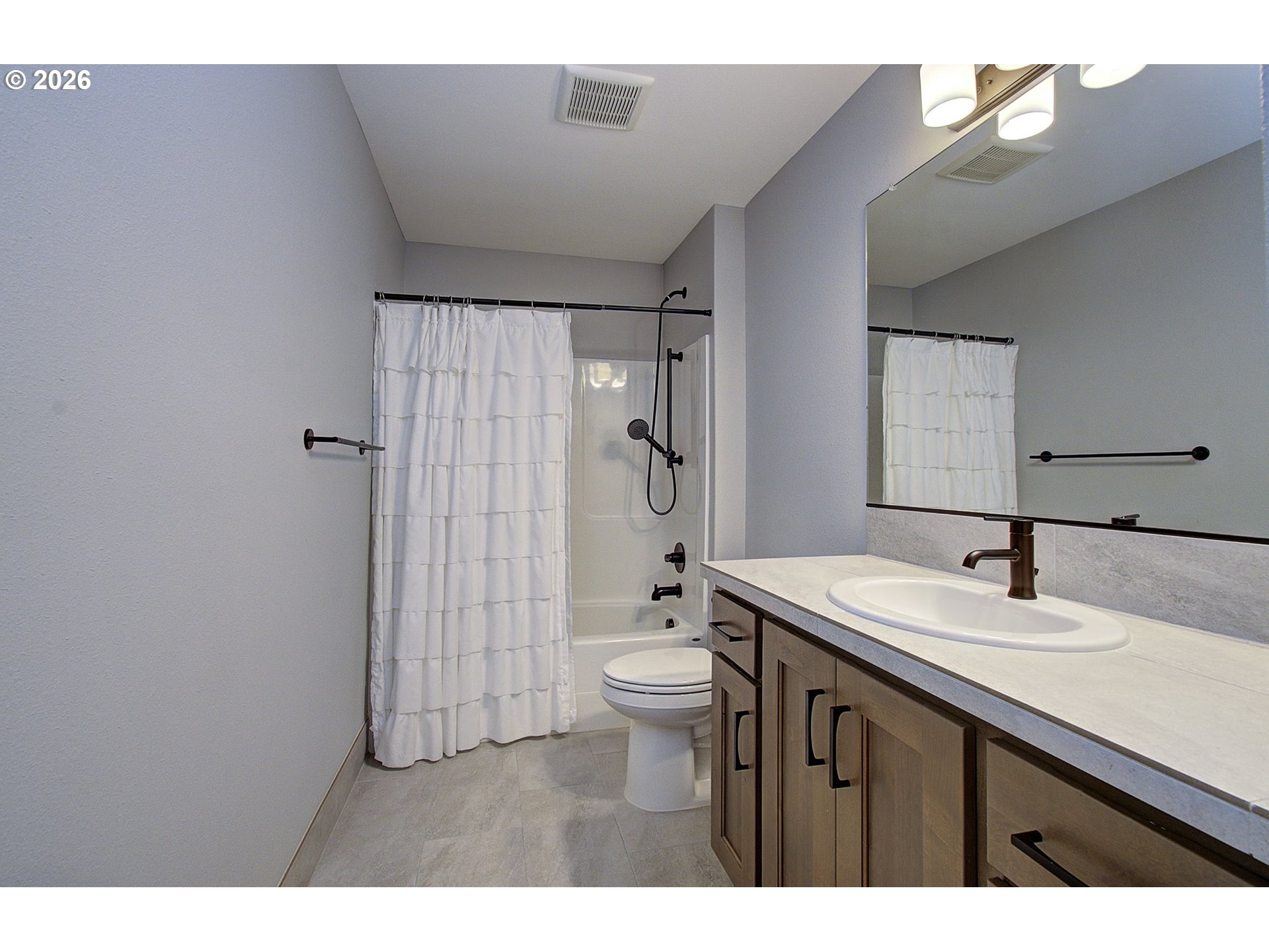 2831 Northeast 9th Avenue Battle Ground, WA 98604 - Photo 28 of 43 a bathroom with a sink a toilet and shower