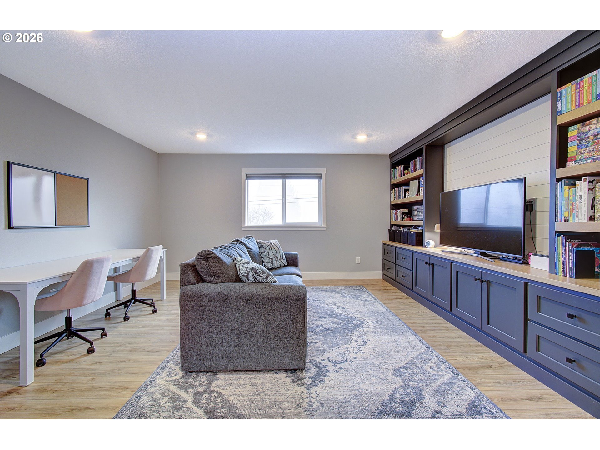 2831 Northeast 9th Avenue Battle Ground, WA 98604 - Photo 29 of 43 a living room with furniture and a flat screen tv