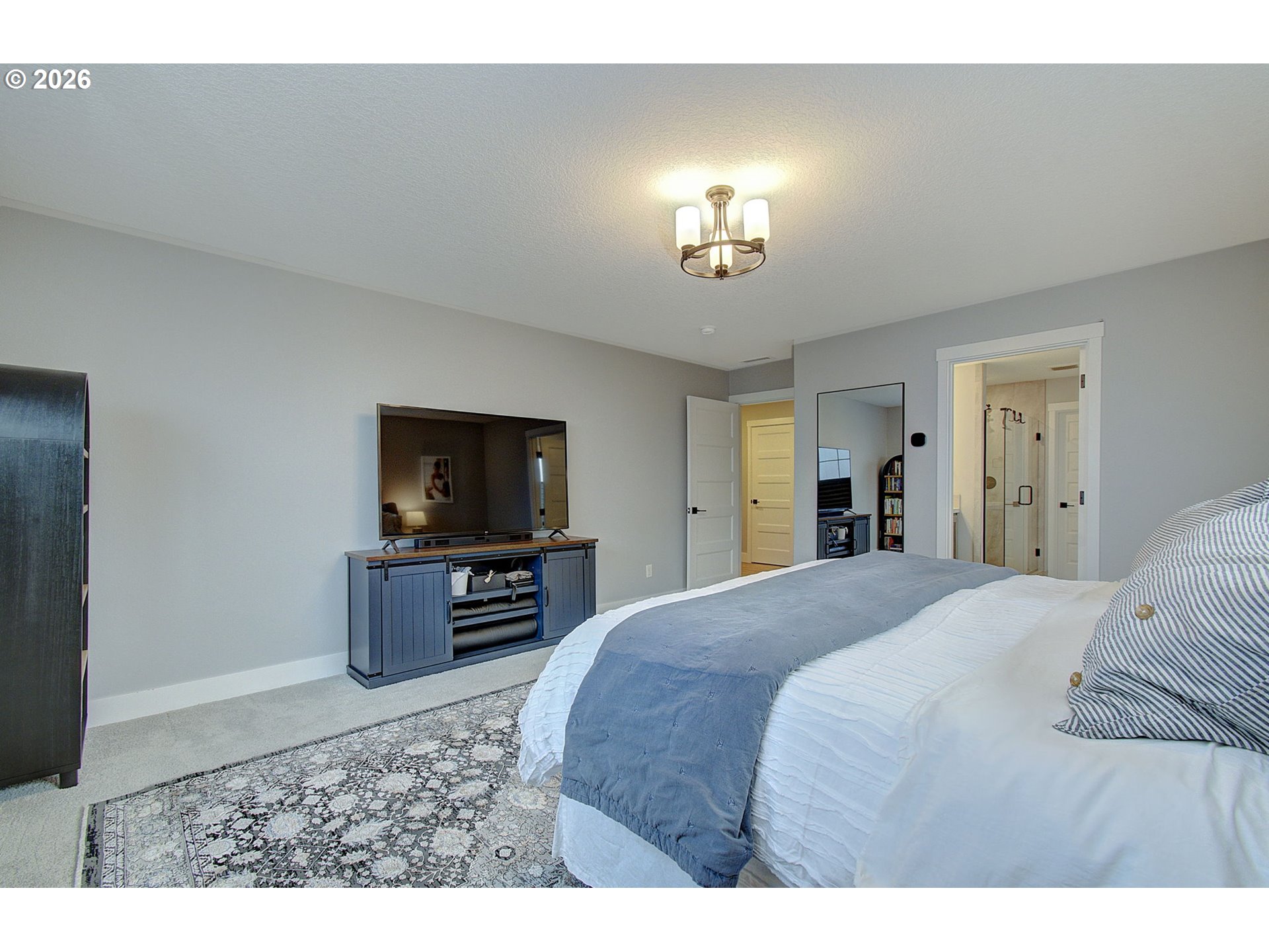 2831 Northeast 9th Avenue Battle Ground, WA 98604 - Photo 34 of 43 a bed room with a bed and a television