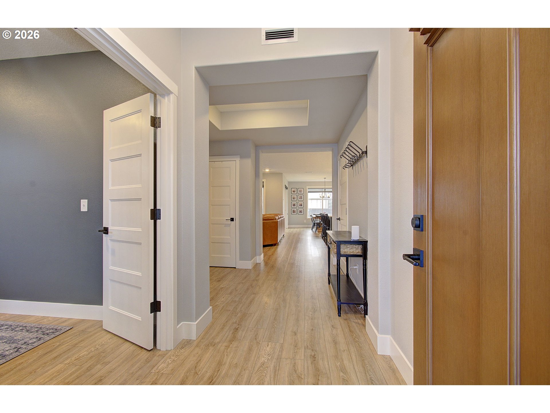 2831 Northeast 9th Avenue Battle Ground, WA 98604 - Photo 8 of 43 a view of a hallway with wooden floor and a bathroom