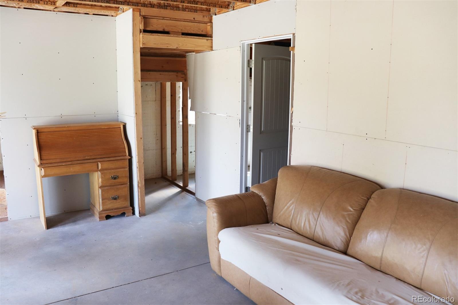 2026 Singletree Road Hartsel, CO 80449 - Photo 13 of 24 a living room with furniture and a flat screen tv