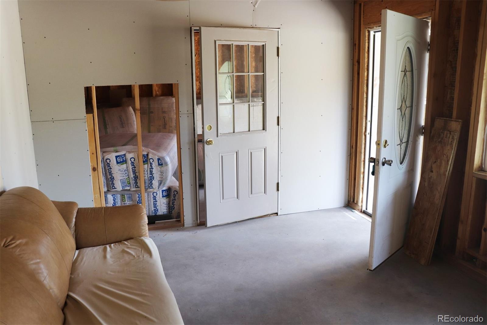 2026 Singletree Road Hartsel, CO 80449 - Photo 15 of 24 a view of a livingroom with furniture and a window