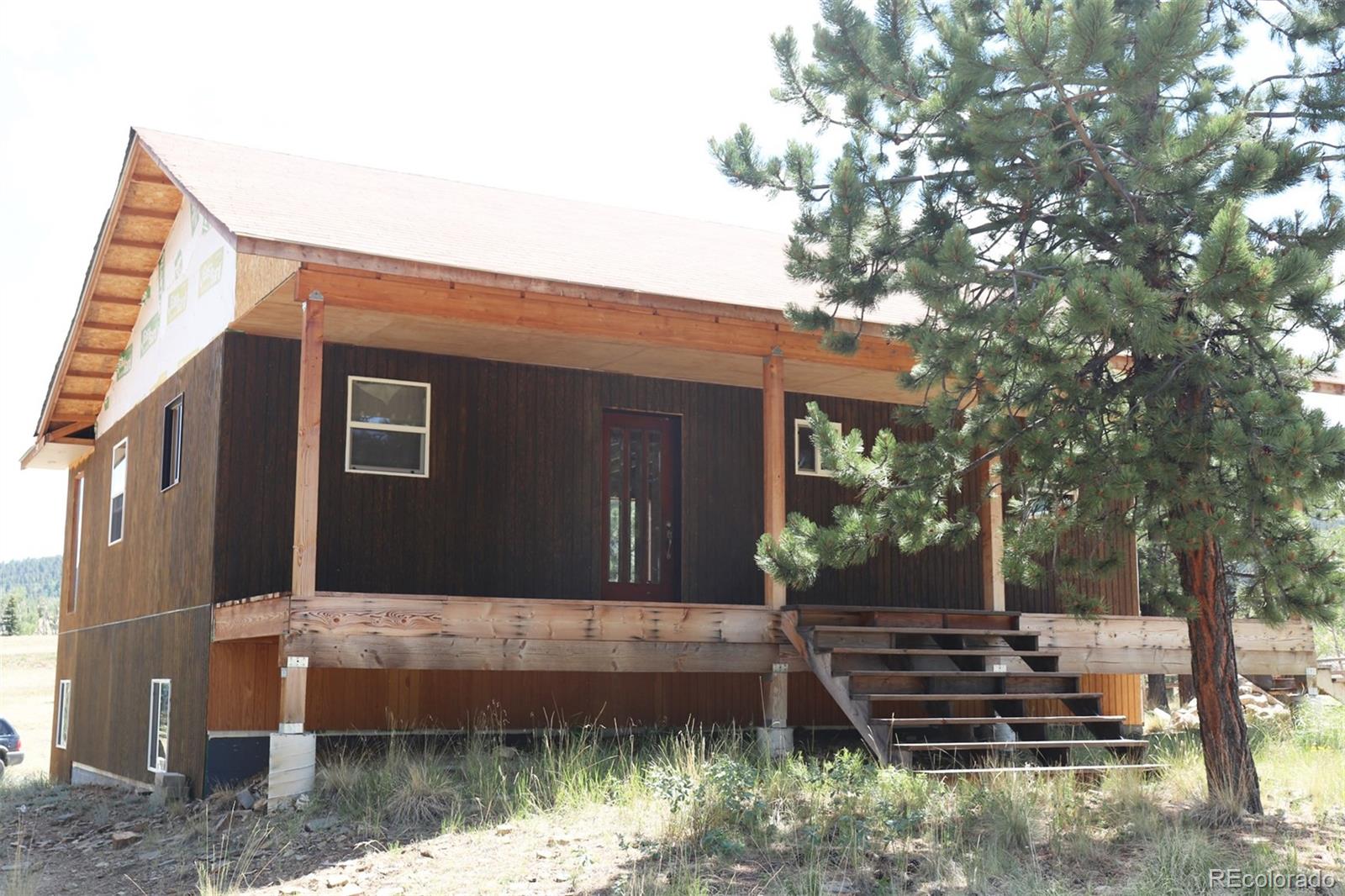 2026 Singletree Road Hartsel, CO 80449 - Photo 3 of 24 a front view of a house with a yard