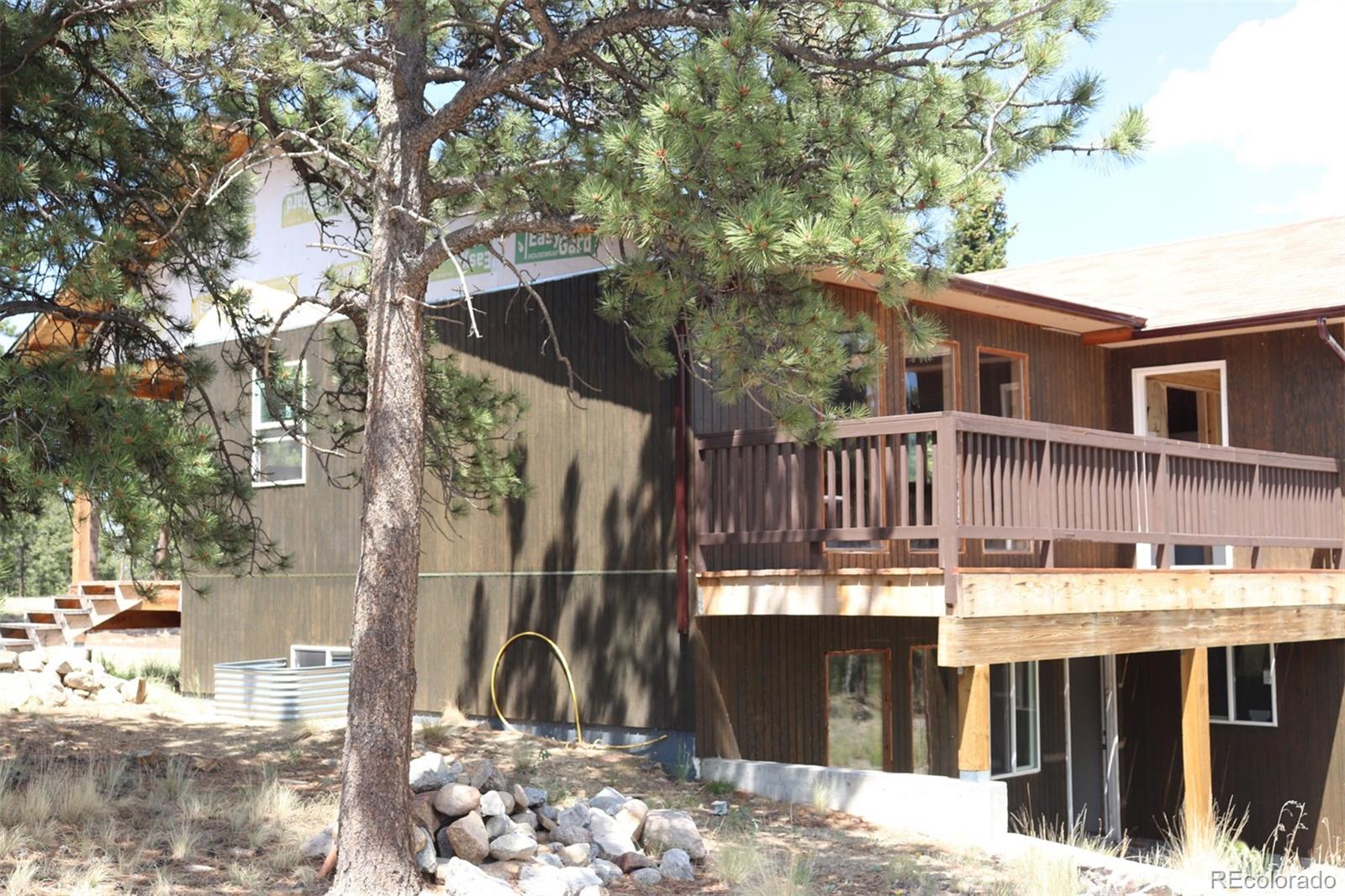 2026 Singletree Road Hartsel, CO 80449 - Photo 5 of 24 a view of a house with a wooden fence
