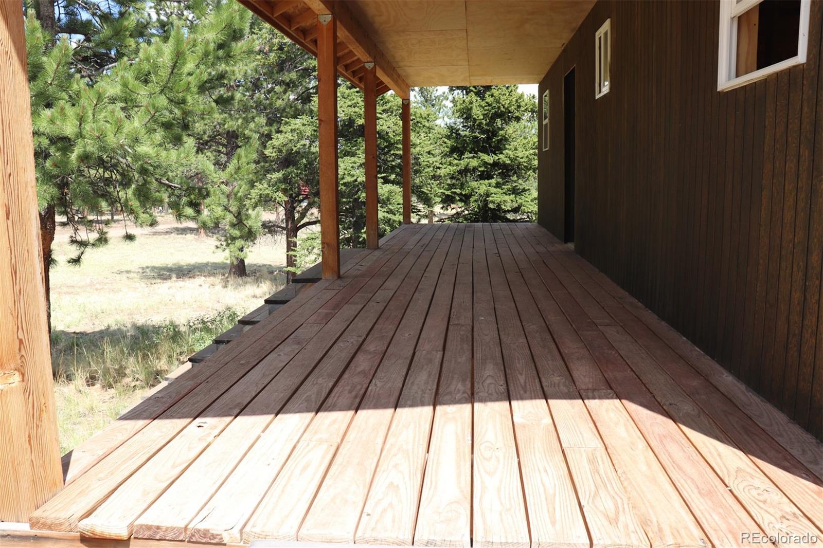 2026 Singletree Road Hartsel, CO 80449 - Photo 6 of 24 a view of balcony with wooden floor