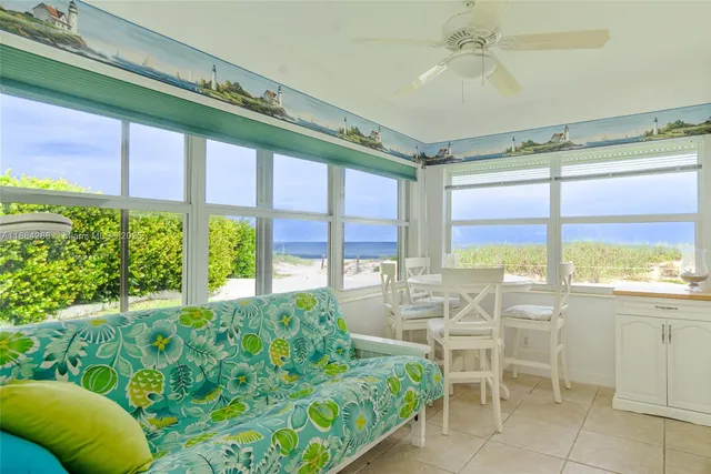 a room with lots of windows and a chandelier