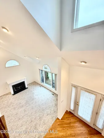 a view of hallway with wooden floor