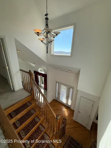 a view of a hallway to rooms