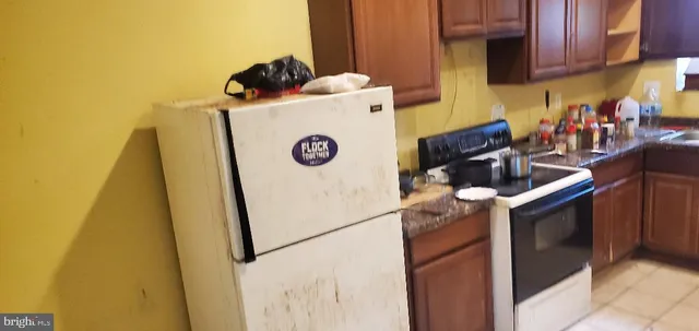 a view of washer and dryer with kitchen countertops