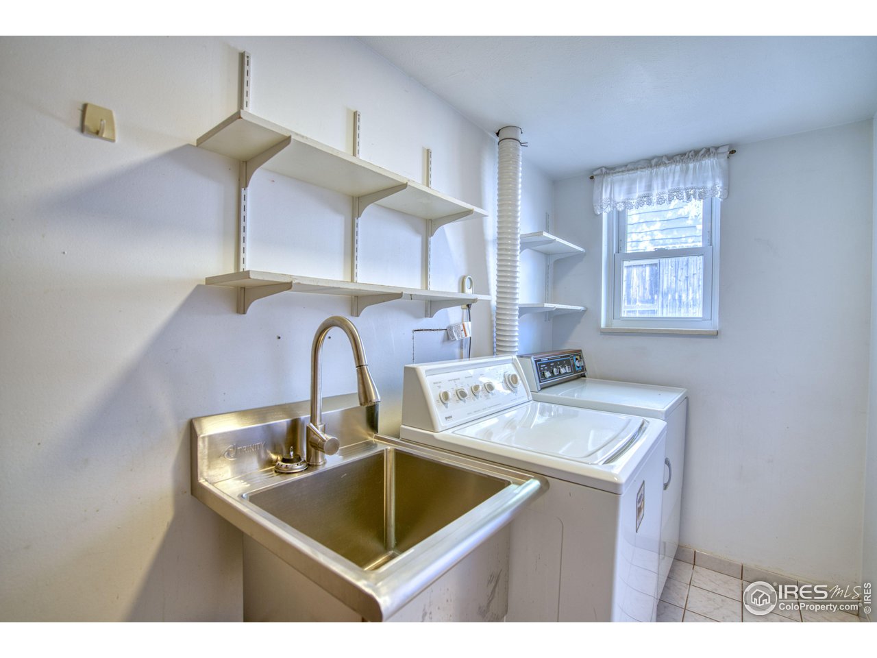 577 Blackhawk Road Boulder, CO 80303 - Photo 23 of 34 Laundry room with stainless steel utility sink