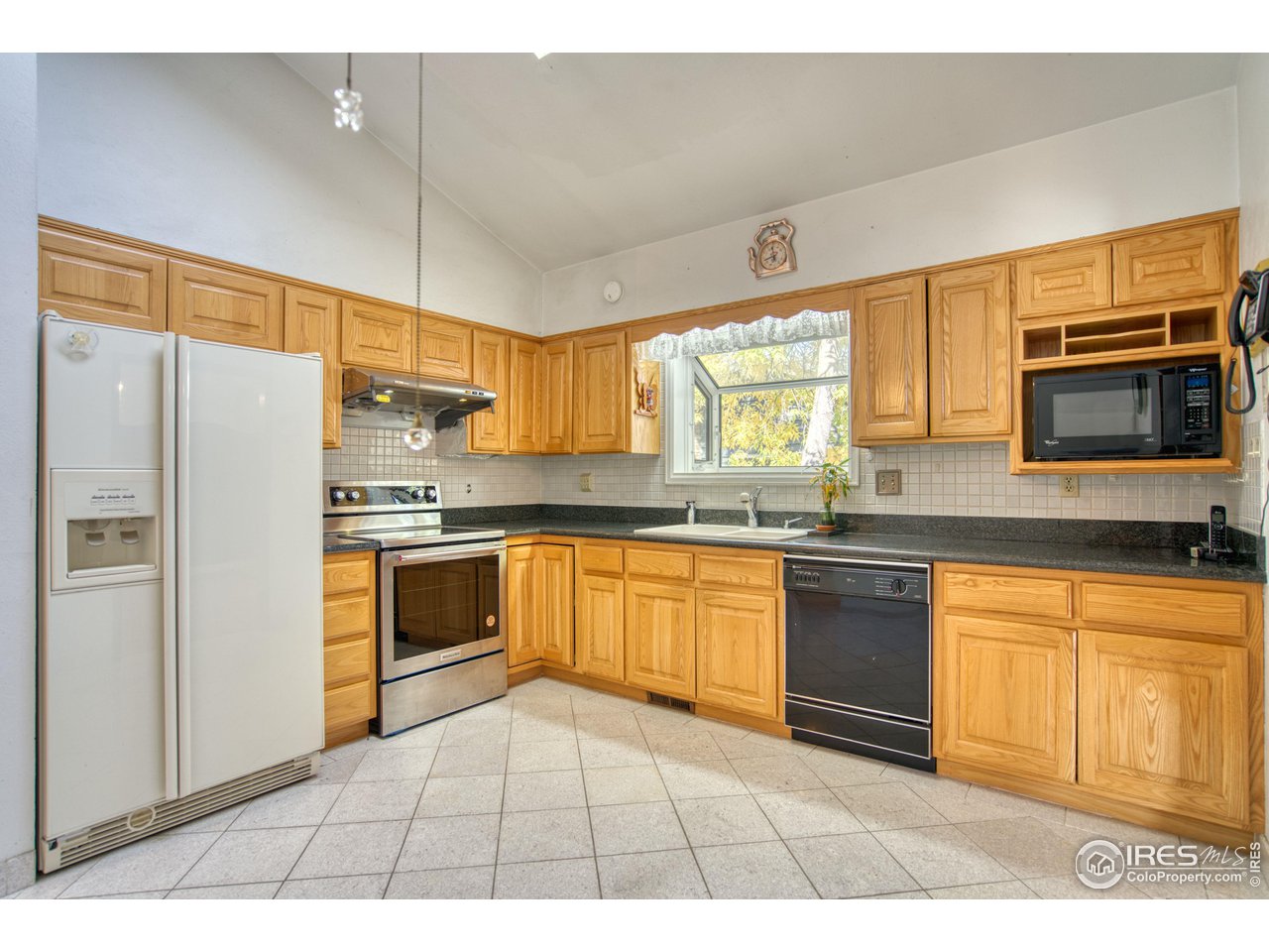 577 Blackhawk Road Boulder, CO 80303 - Photo 10 of 34 Kitchen with bay window over sink and skylight above offer plenty of natural light