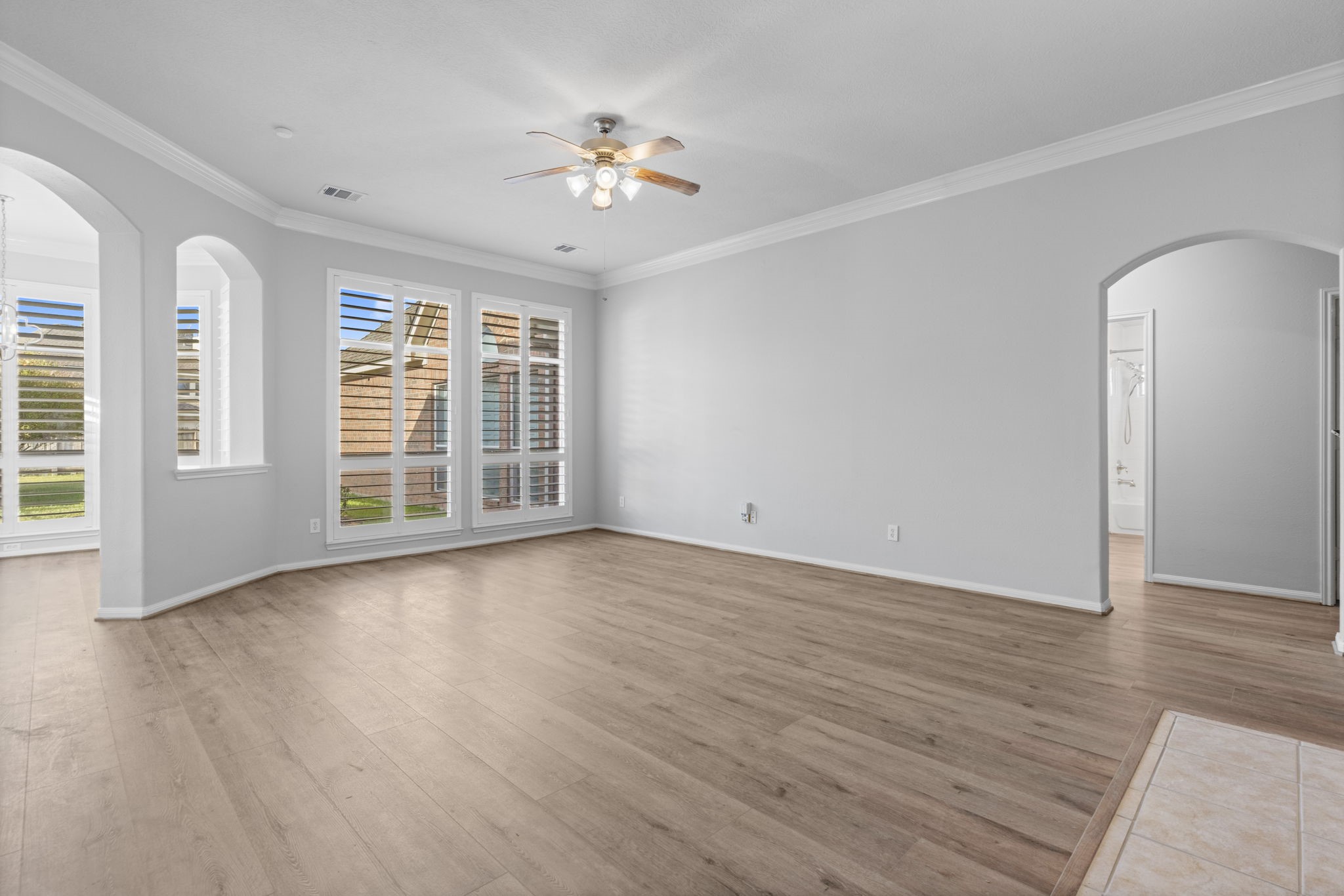6515 Pine Arrow Court Spring, TX 77389 - Photo 11 of 31 a view of an empty room with a window and wooden floor