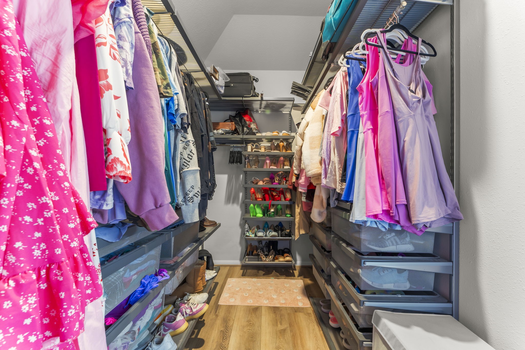 6515 Pine Arrow Court Spring, TX 77389 - Photo 22 of 31 Large walk-in closet with custom shelving, storage bins and racks.