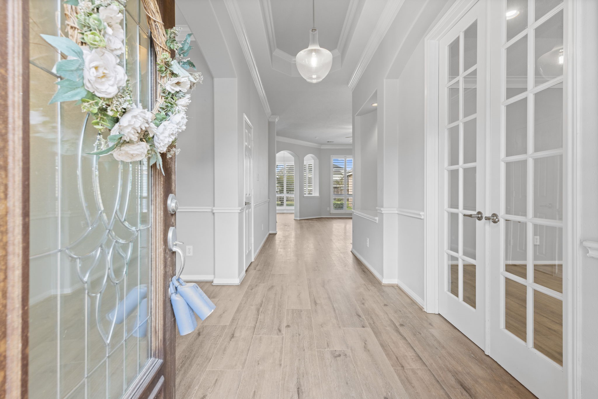 6515 Pine Arrow Court Spring, TX 77389 - Photo 4 of 31 a view of a hallway with wooden floor and staircase