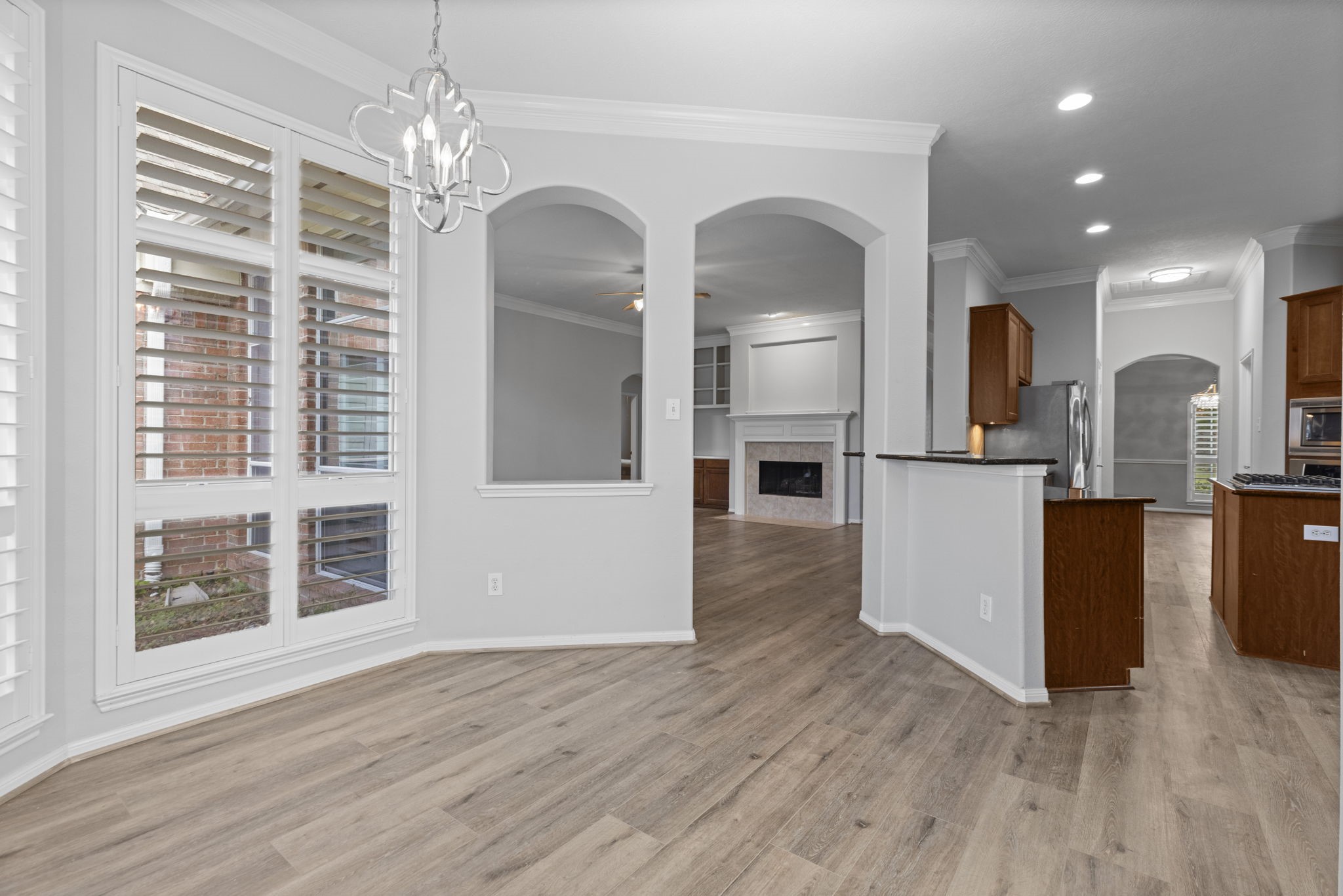 6515 Pine Arrow Court Spring, TX 77389 - Photo 10 of 31 a view of a kitchen with kitchen island wooden floor and center island