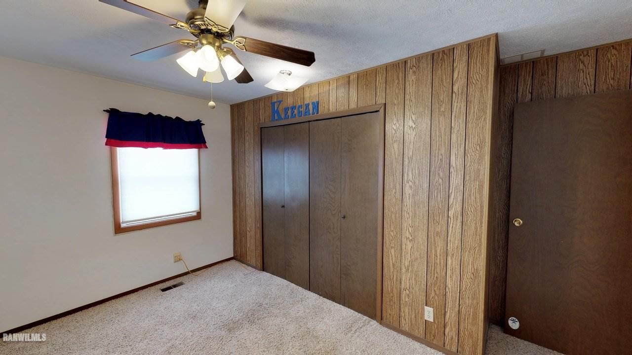 11280 Benson Road Lanark, IL 61046 - Photo 16 of 20 an empty room with windows and fan