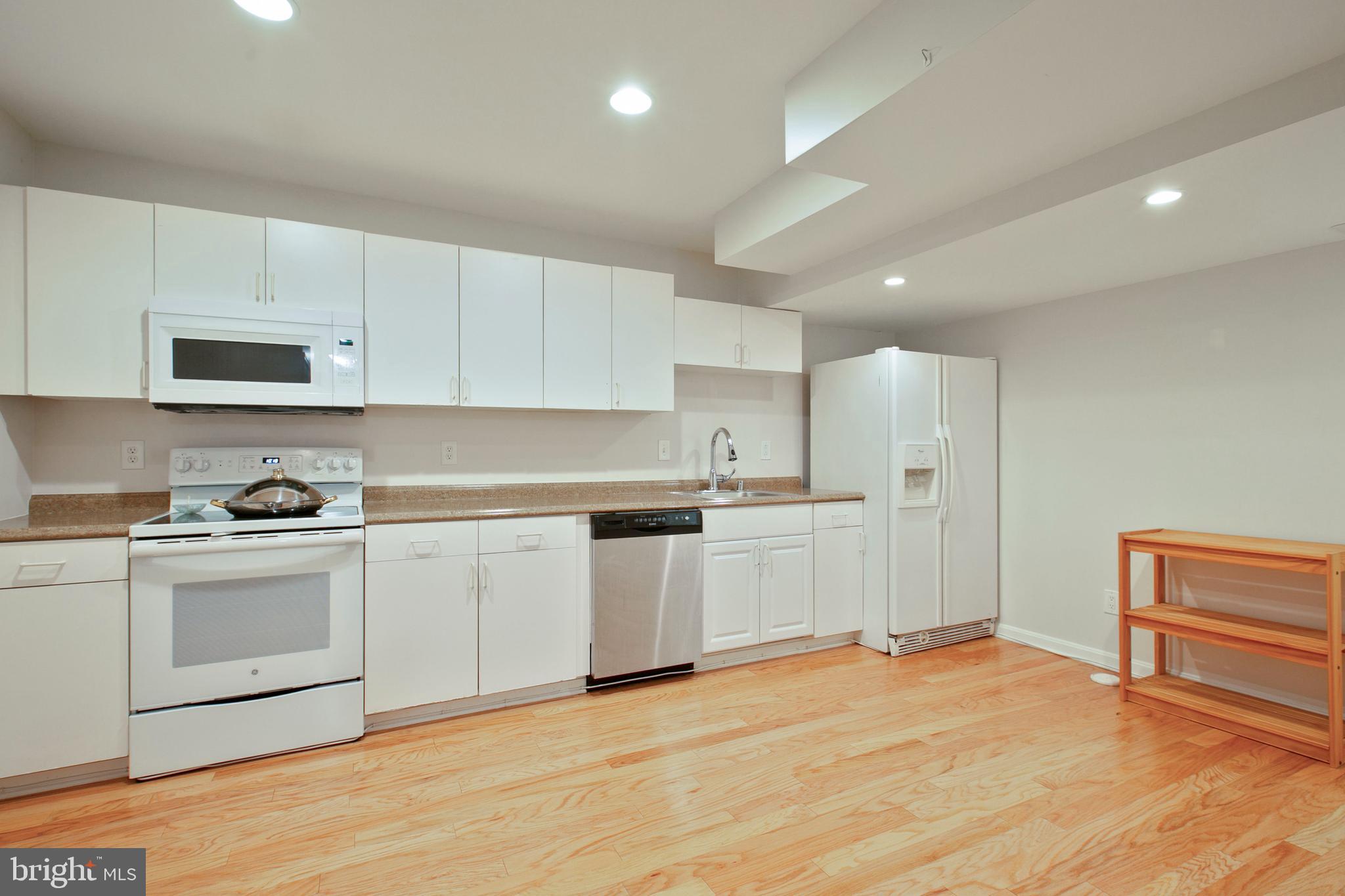 5814 Pimlico Road Baltimore, MD 21209 - Photo 45 of 58 Lower Level Full Kitchen with Hardwood Floors