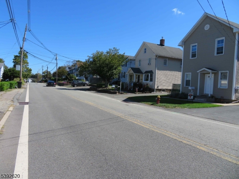 297 Center Street, Unit A Landing, NJ 07850 - Photo 1 of 18 a front view of a house with a yard