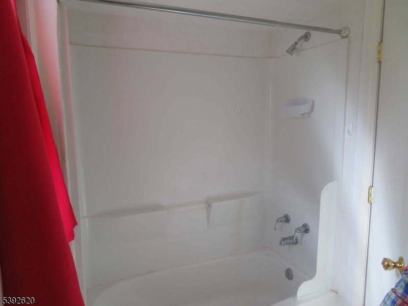 297 Center Street, Unit A Landing, NJ 07850 - Photo 15 of 18 a close up of a bathtub