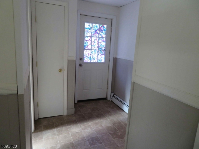 297 Center Street, Unit A Landing, NJ 07850 - Photo 15 of 17 an empty room with windows