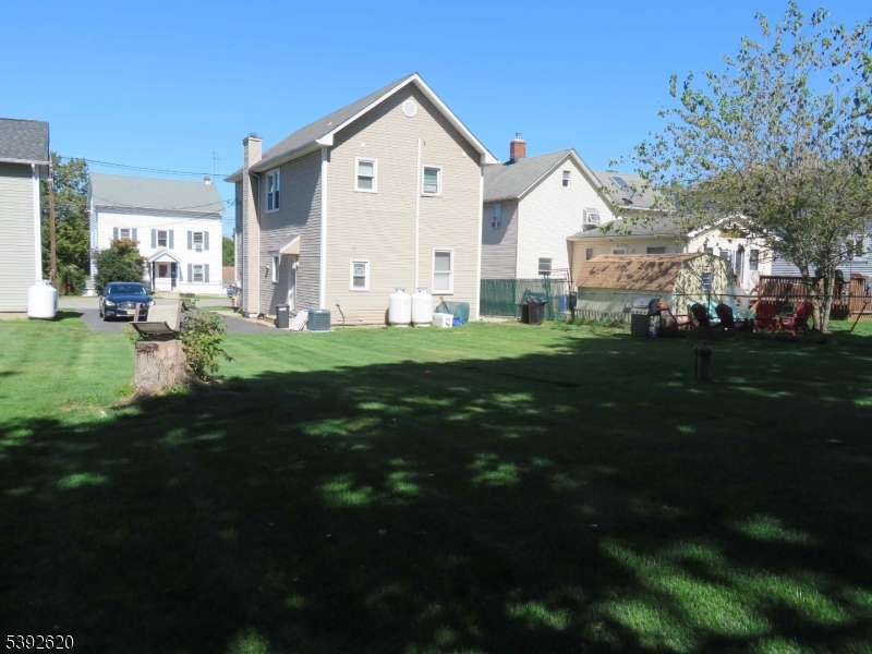 297 Center Street, Unit A Landing, NJ 07850 - Photo 2 of 17 a view of a house with a big yard and large trees