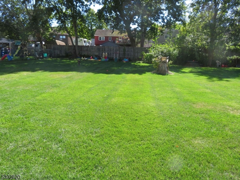 297 Center Street, Unit A Landing, NJ 07850 - Photo 3 of 17 a view of a backyard with large trees