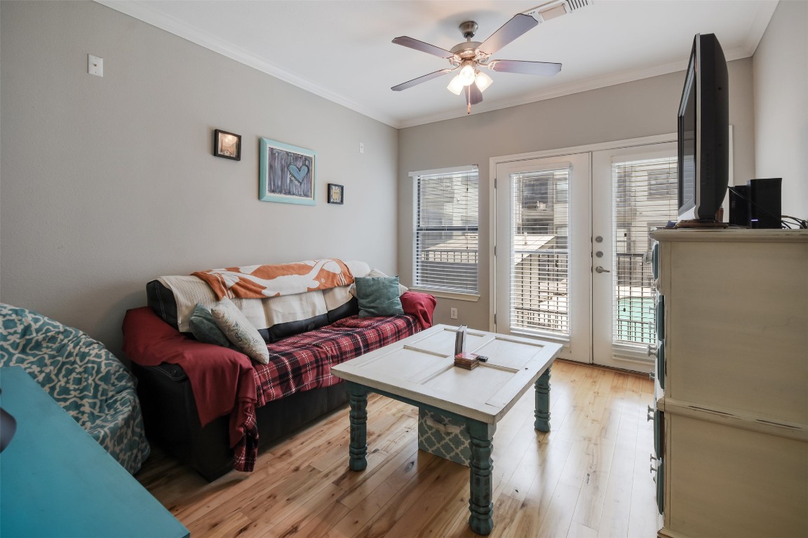 2502 Leon Street, Unit 313 Austin, TX 78705 - Photo 13 of 27 a living room with furniture and a flat screen tv