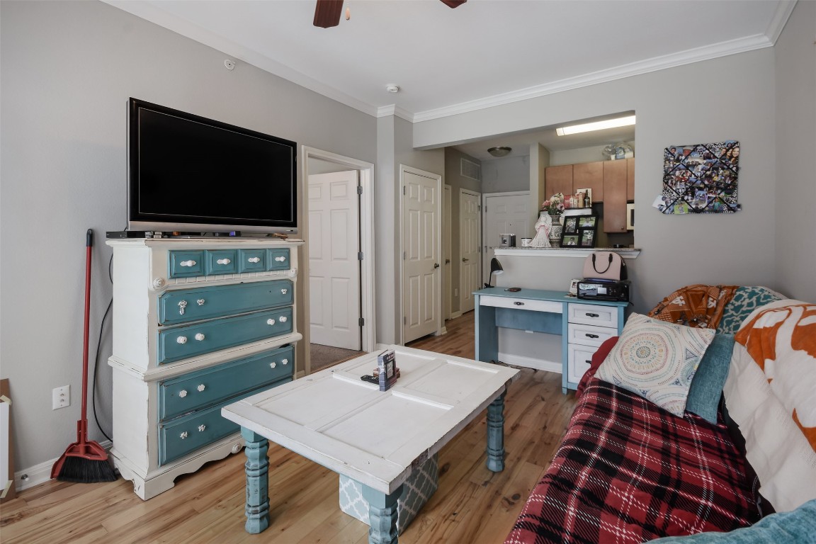 2502 Leon Street, Unit 313 Austin, TX 78705 - Photo 15 of 27 a living room with furniture and a flat screen tv