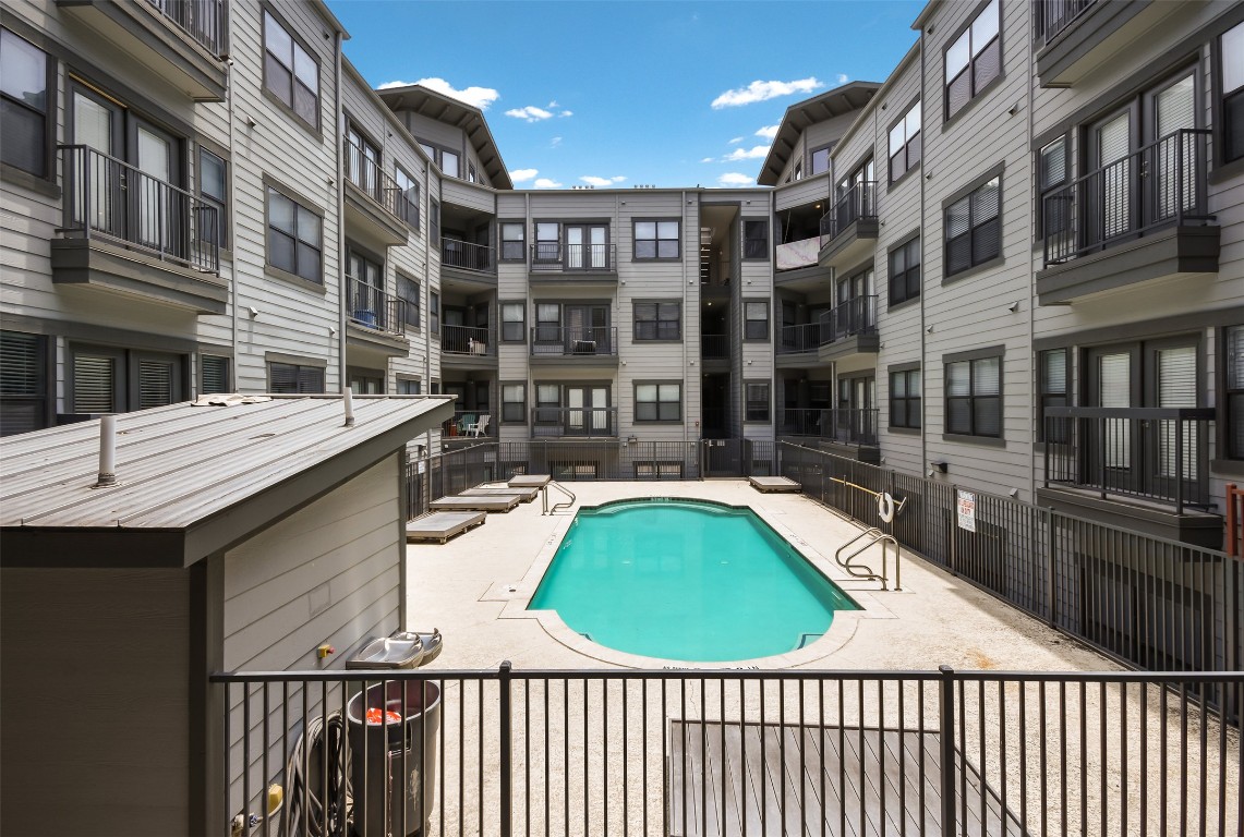 2502 Leon Street, Unit 313 Austin, TX 78705 - Photo 20 of 27 a view of a balcony with a swimming pool