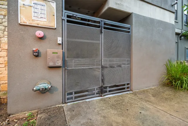 a front view of a residential apartment building with a yard