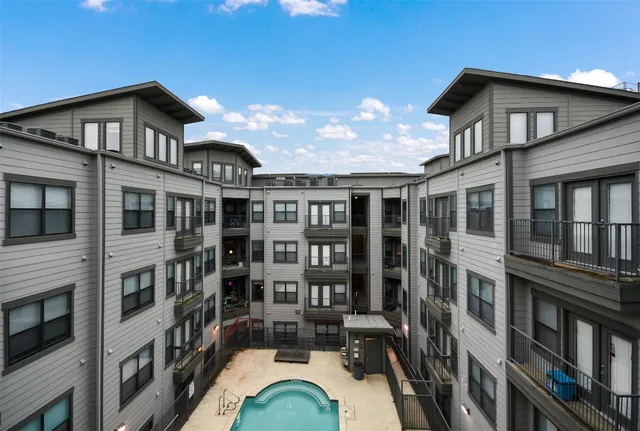 a view of a swimming pool with outdoor seating and stairs