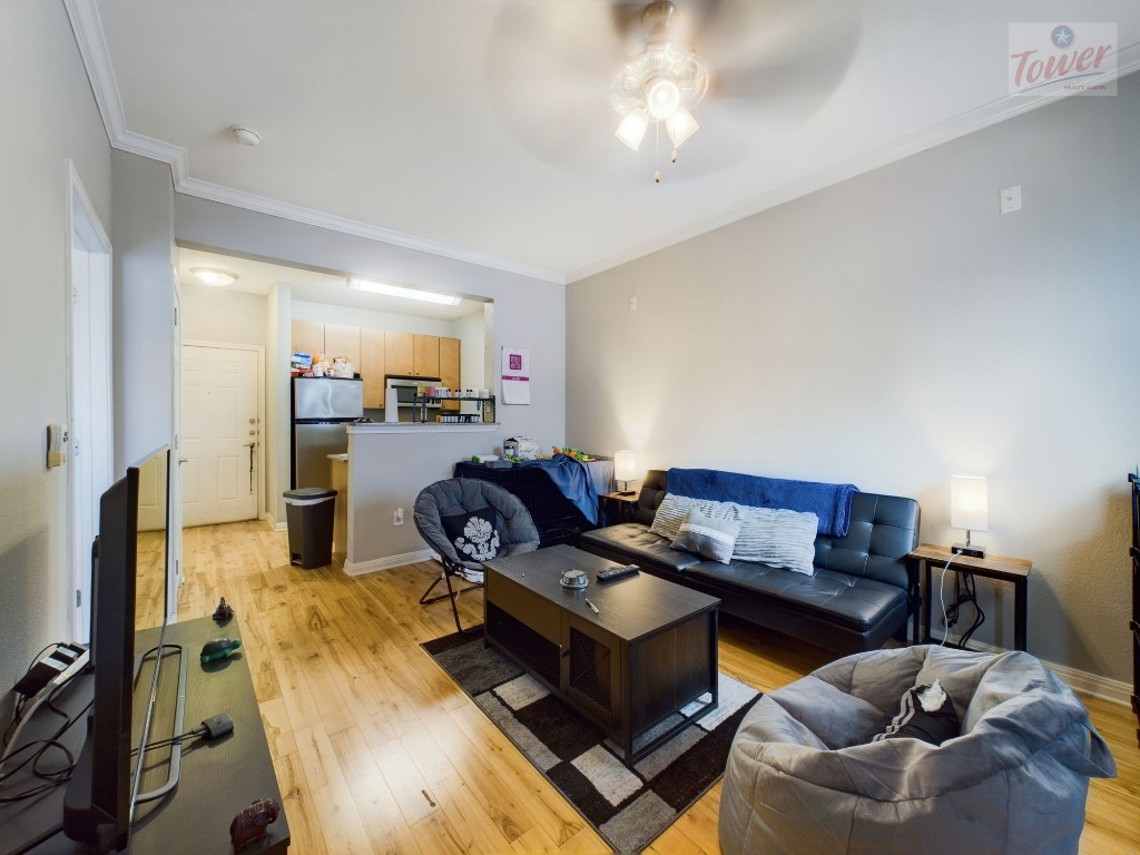 2502 Leon Street, Unit 313 Austin, TX 78705 - Photo 4 of 27 a living room with furniture and a flat screen tv