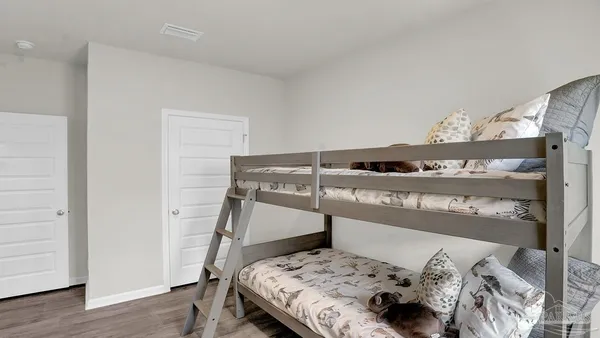 a front view of a dresser with wooden floor