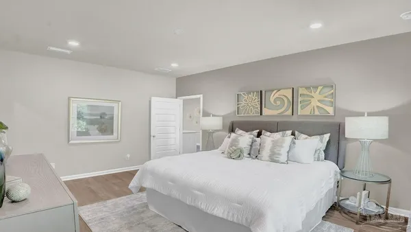 a bedroom with a bed and a dresser