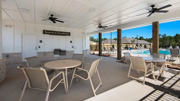 a view of swimming pool with chairs