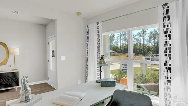 a view of a bathroom with tub and mirror