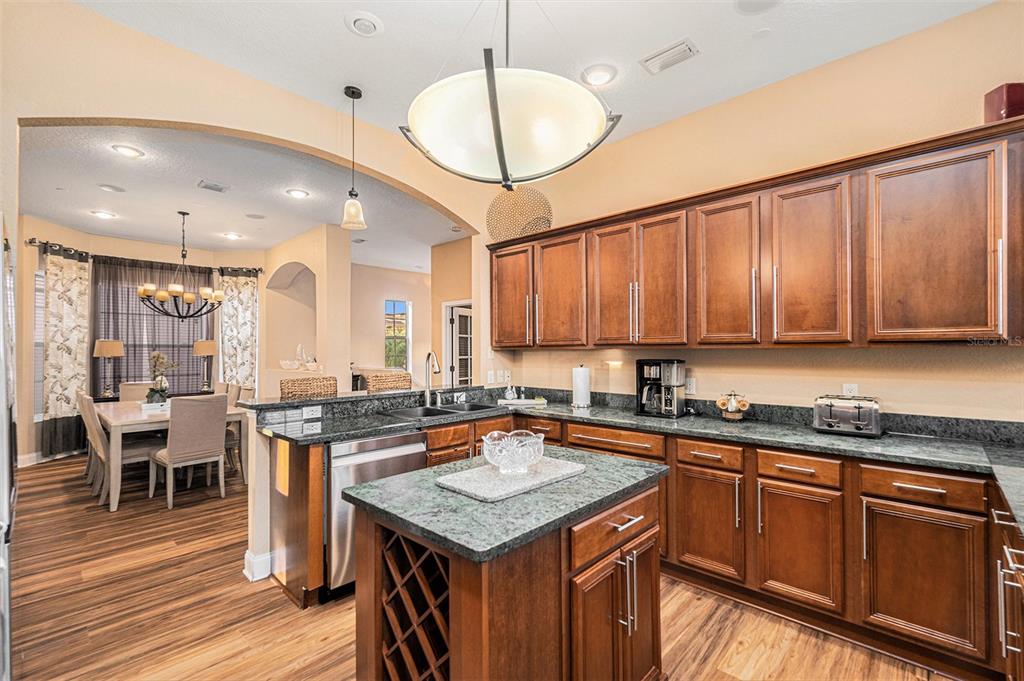 1316 Apollo Beach Boulevard South Apollo Beach, FL 33572 - Photo 29 of 47 a kitchen with granite countertop a sink a counter space appliances and cabinets