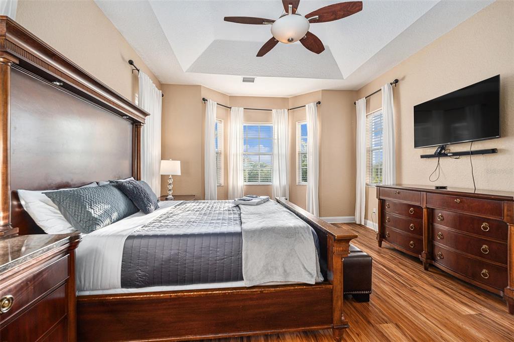 1316 Apollo Beach Boulevard South Apollo Beach, FL 33572 - Photo 31 of 47 a bedroom with a bed and a flat screen tv