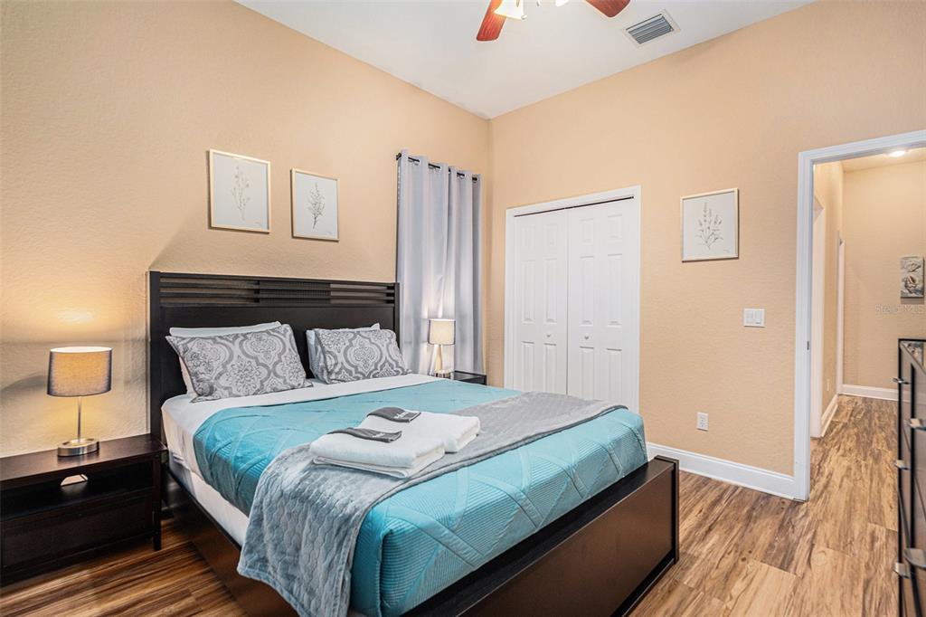 1316 Apollo Beach Boulevard South Apollo Beach, FL 33572 - Photo 32 of 47 a bedroom with a bed and a walk in closet