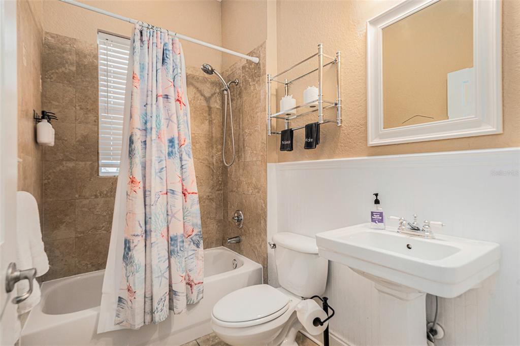 1316 Apollo Beach Boulevard South Apollo Beach, FL 33572 - Photo 34 of 47 a bathroom with a sink toilet and shower