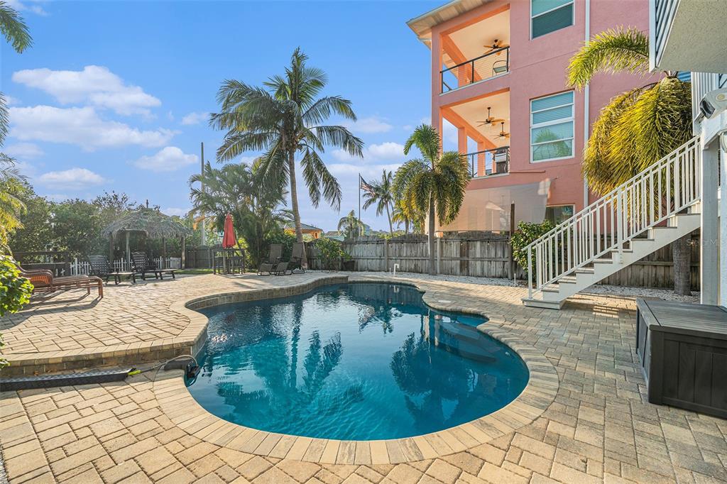 1316 Apollo Beach Boulevard South Apollo Beach, FL 33572 - Photo 39 of 47 a view of a swimming pool with a lounge chairs