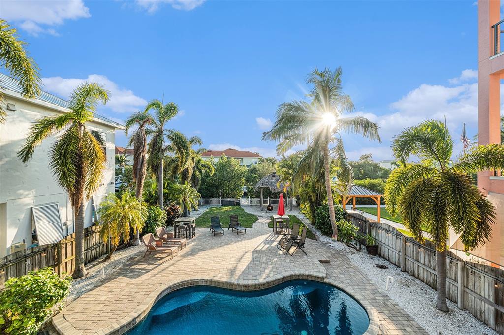 1316 Apollo Beach Boulevard South Apollo Beach, FL 33572 - Photo 40 of 47 a view of a house with swimming pool and sitting area