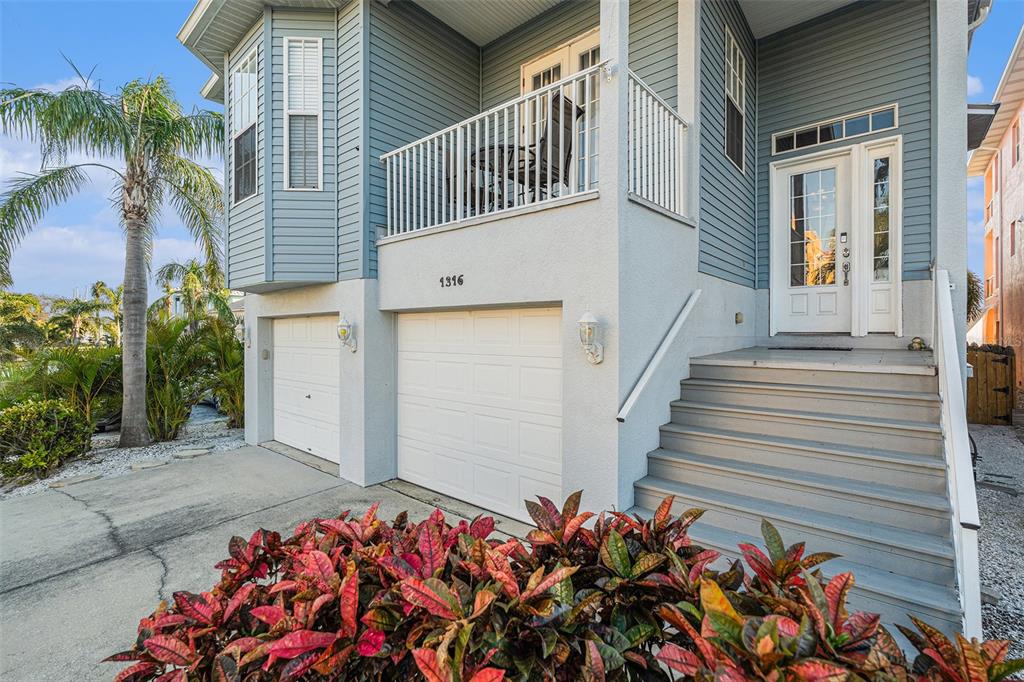 1316 Apollo Beach Boulevard South Apollo Beach, FL 33572 - Photo 43 of 47 a view of a house with a flower garden