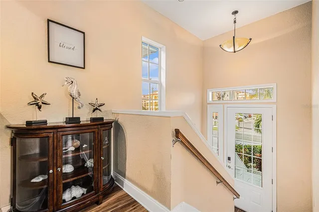 a kitchen with stainless steel appliances granite countertop a sink a stove a counter space and dining table