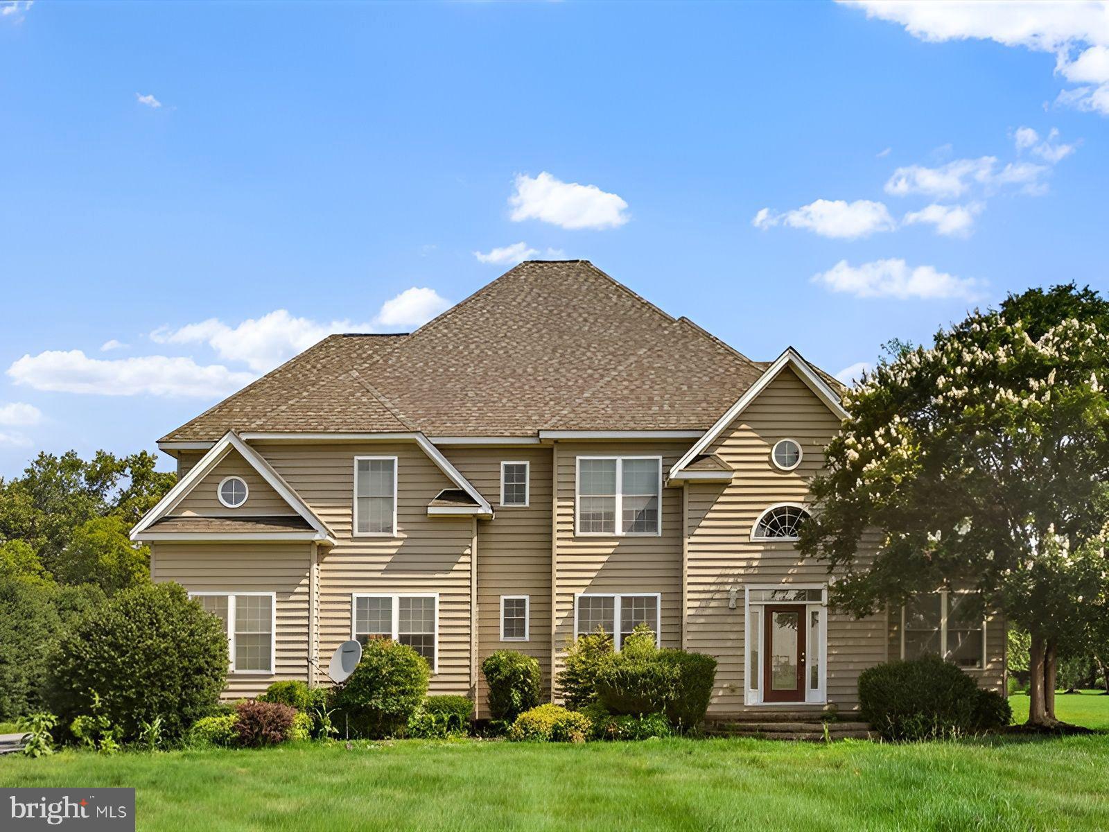 front view of a house and a yard