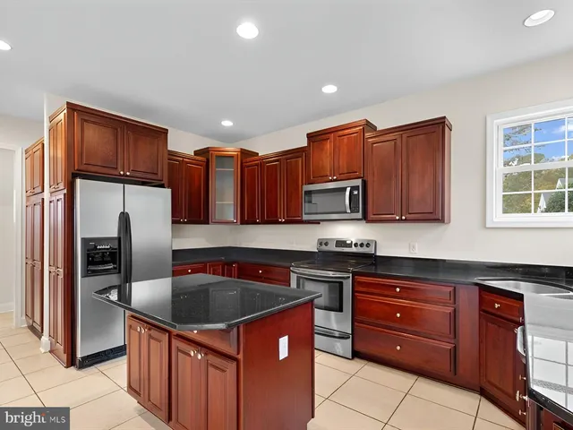 a view of a livingroom with furniture and a table