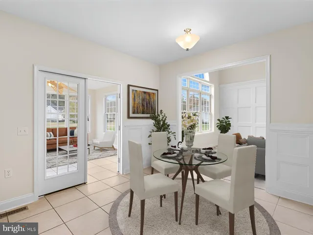 a view of an empty room with cabinet and a fireplace