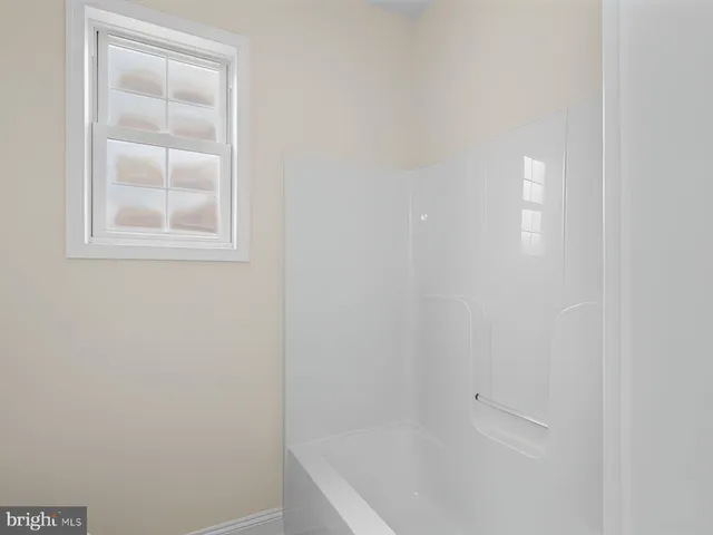 a bedroom with furniture and a fireplace