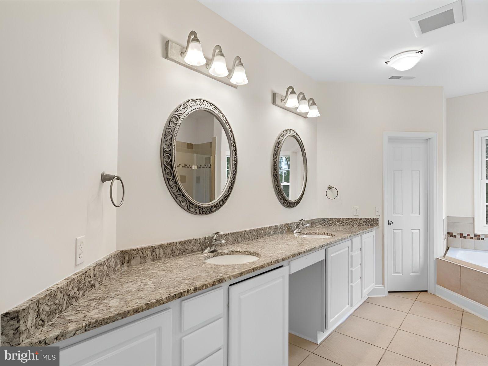 3236 Noble Farm Road Eden, MD 21822 - Photo 42 of 57 a bathroom with a granite countertop sink and a mirror